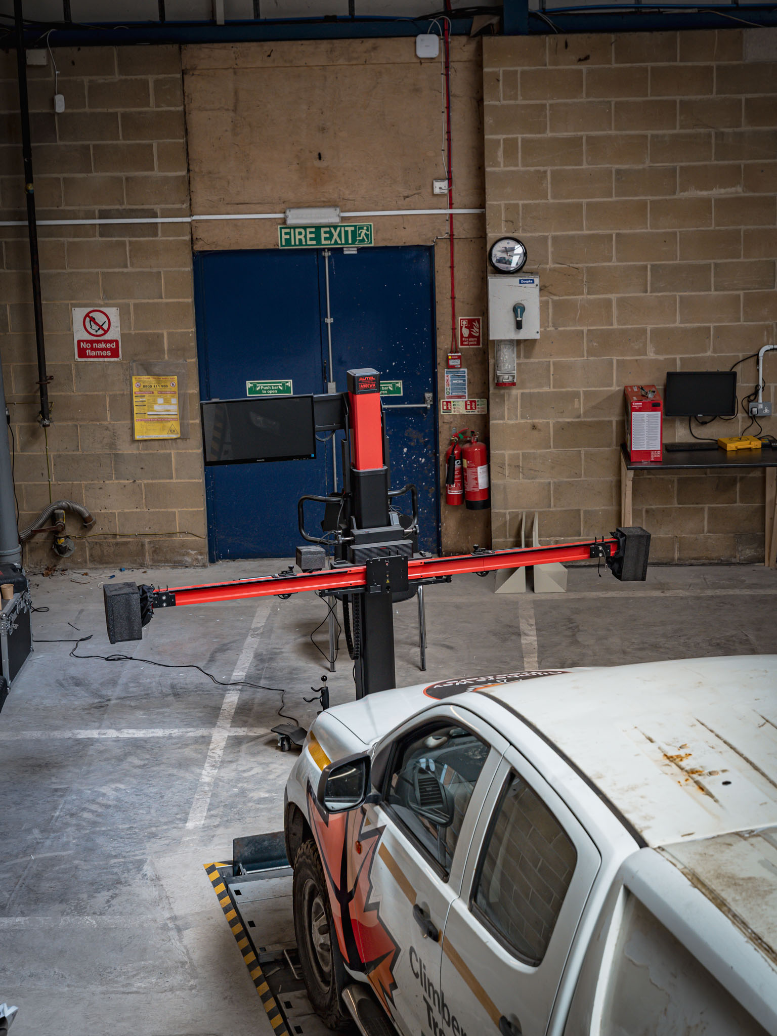 Autel ADAS calibration target frame positioned in front of a vehicle during calibration