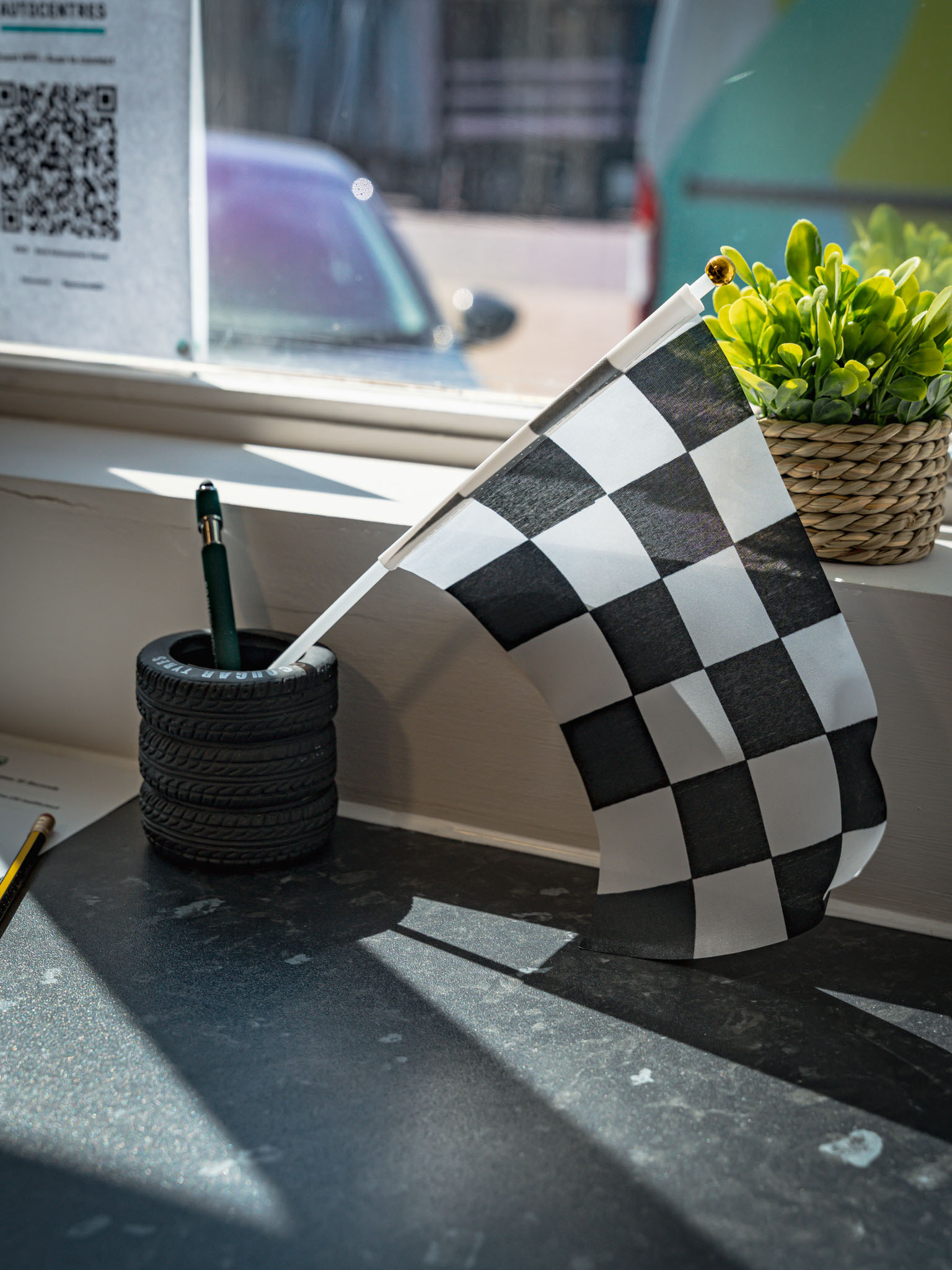 Chequered flag detail on the Best Autocentres Totton reception desk
